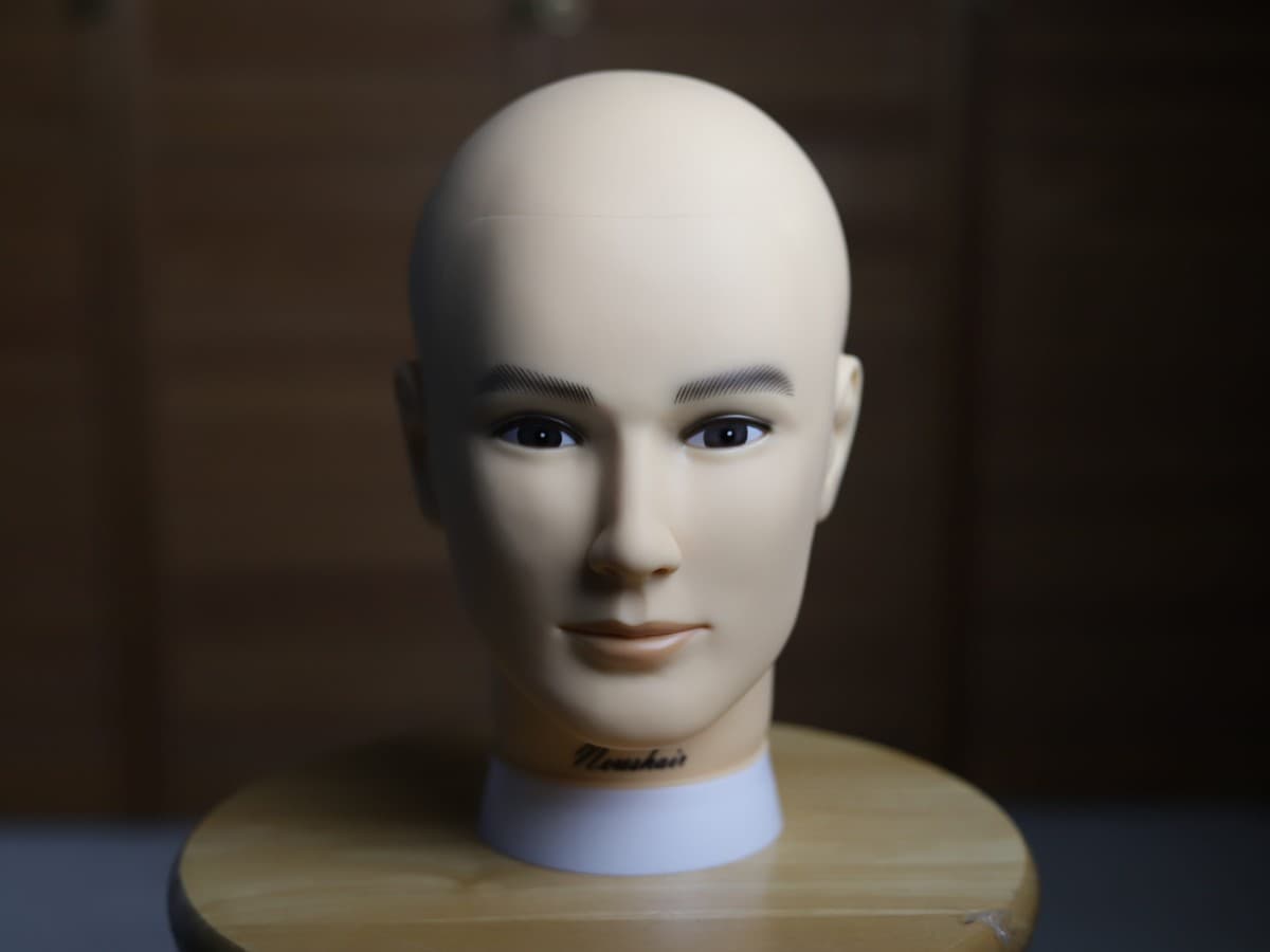 Softbox close to subject for soft light Mannequin head being lit up by a close softbox for soft light.