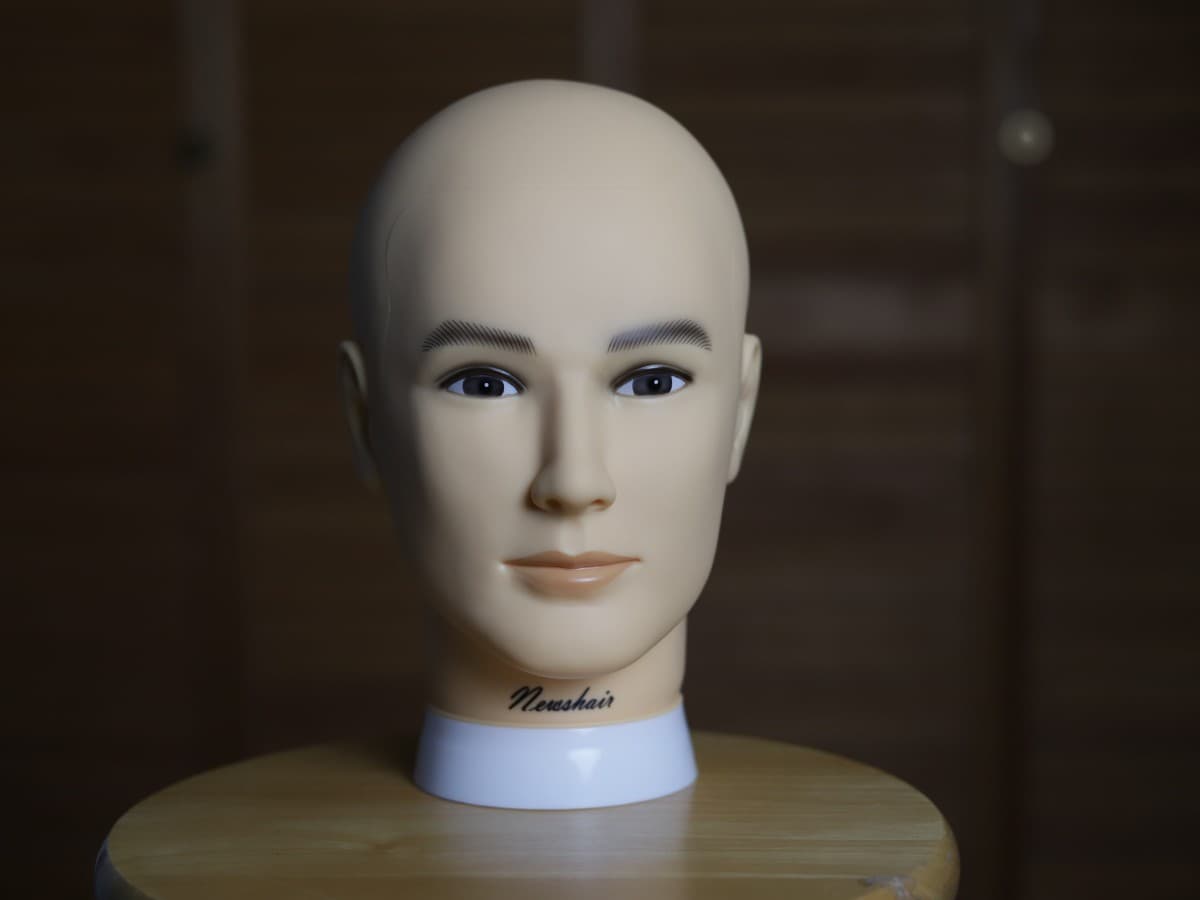 Softbox further away from subject creating flat image Mannequin head with a softbox further away creating a flat image.