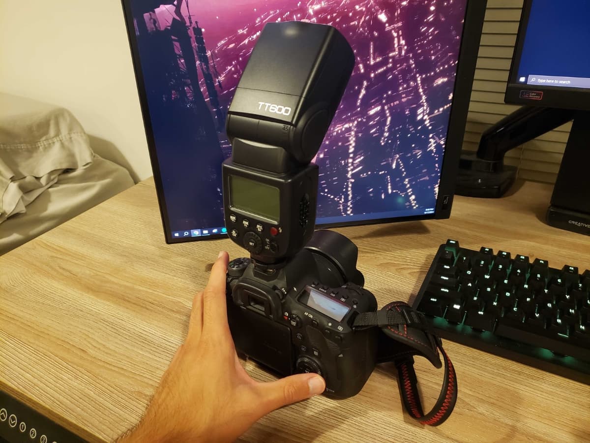 Speedlight on my hot shoe (Canon 6D Mark II) Speedlight on a hot shoe on a camera.