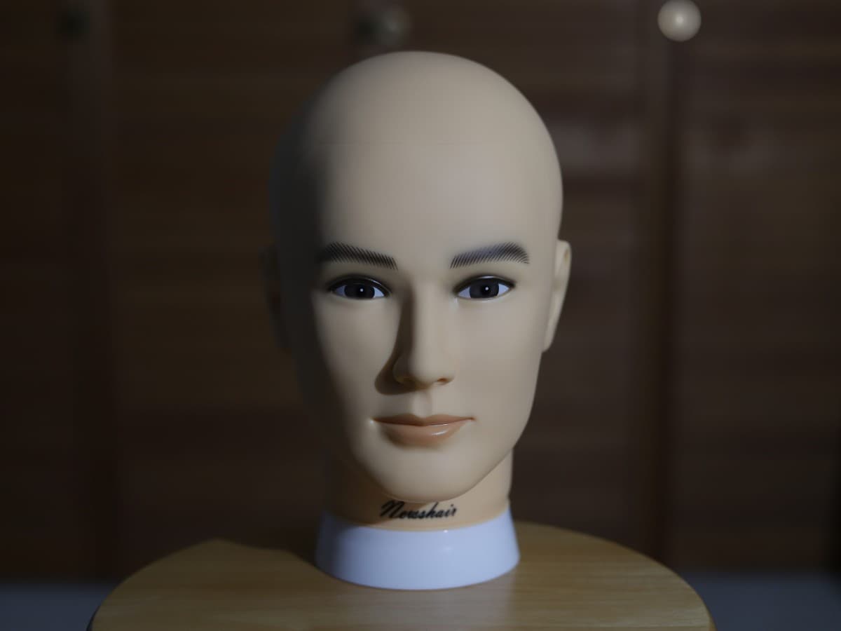 Strobe light no diffusion further from subject softens light a bit Strobe light with no diffusion further from mannequin head creating soft light.