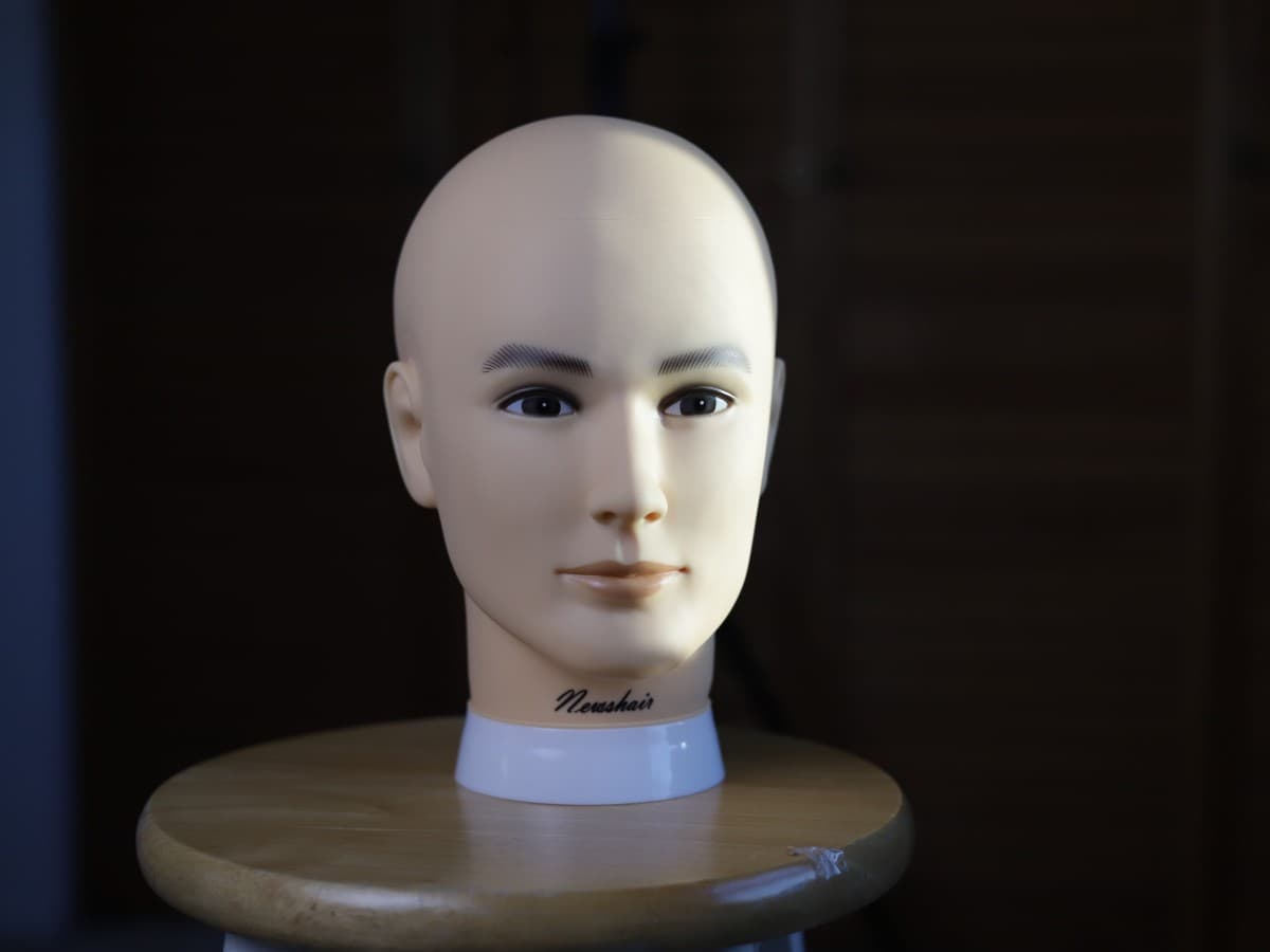 Studio light opposite side as window light photo Mannequin head being lit up by window light and studio softbox.