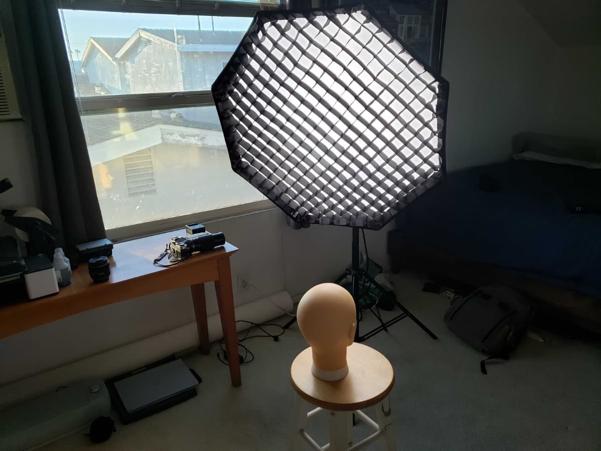 Studio light same side as window light Softbox and a mannequin on a stool.